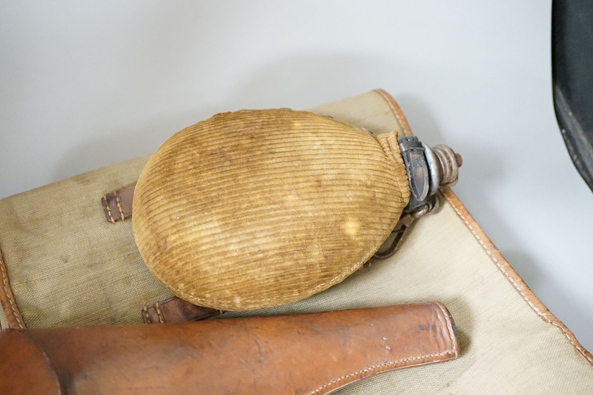 Miscellaneous WWI accessories including a water bottle, and a WWII Japanese pilot's cap